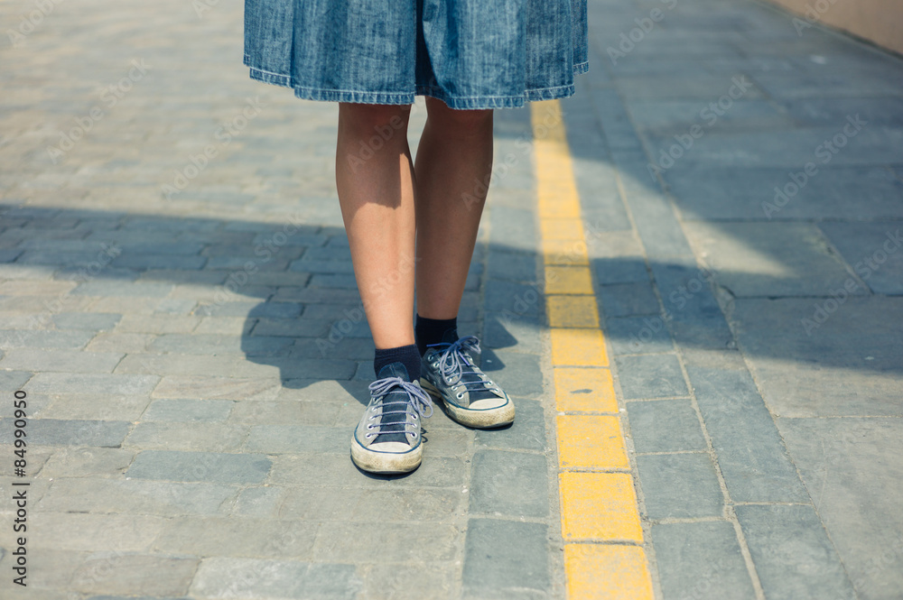Legs of woman tanding in the street Legs of woman tanding in the street