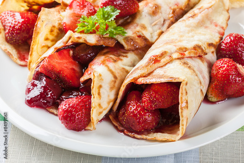 Traditional crepes served with strawberries