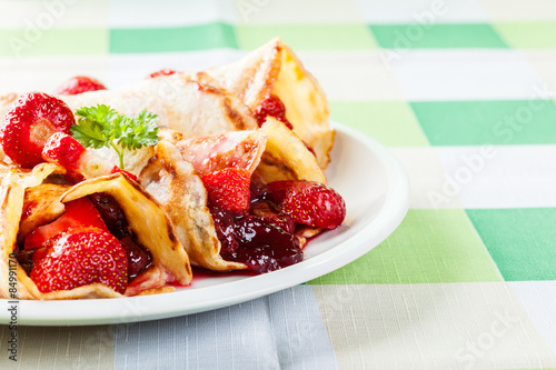 Traditional crepes served with strawberries