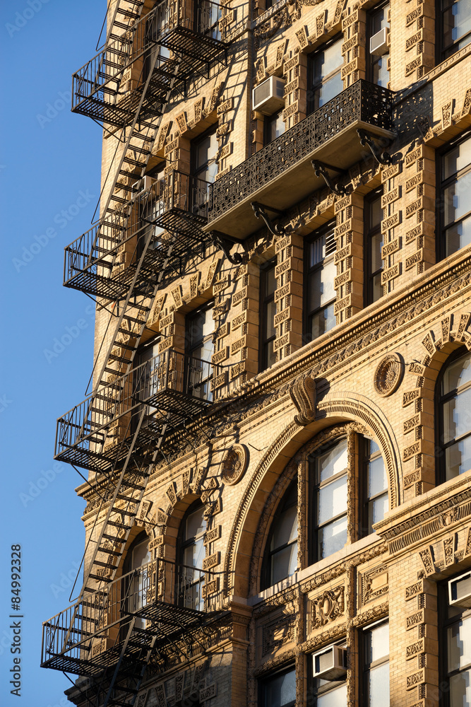 Chelsea building with wrought iron balcony and fire escape, Manhattan, New York City