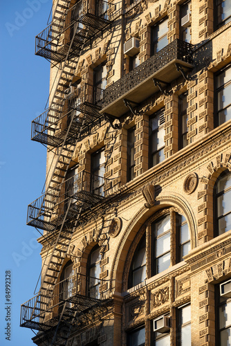 Canvas Print Chelsea building with wrought iron balcony and fire escape, Manhattan, New York