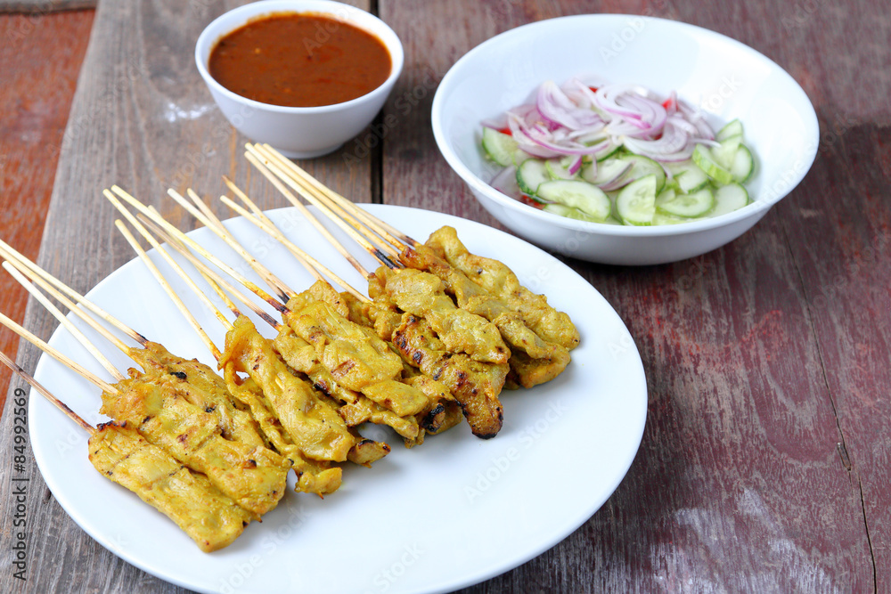 Pork Satay with Peanut Sauce, Wood table background. Pork Satay with Peanut Sauce, Wood table background.