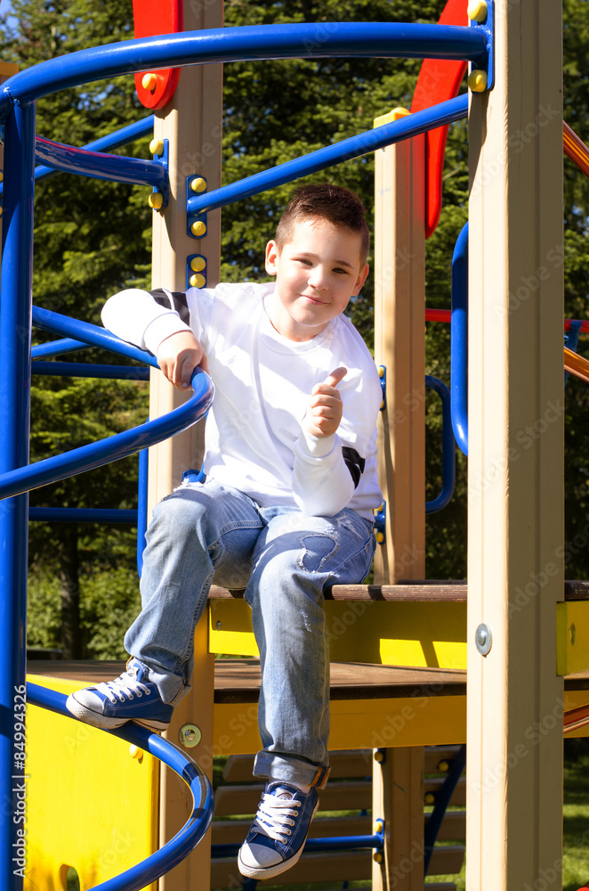 Obraz premium happy boy on the playground