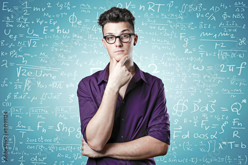 Closeup portrait of a young genius man confused photo