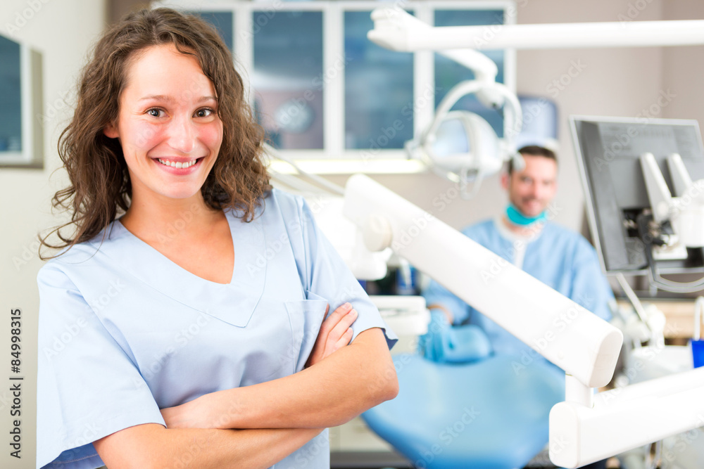 Fototapeta premium Portrait of a young attractive dentist in his office