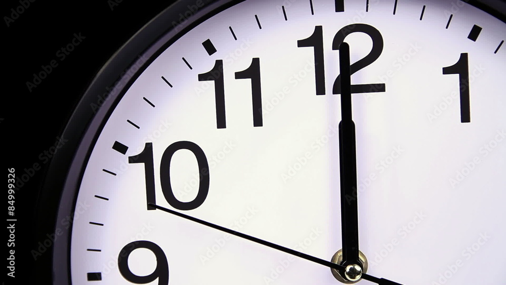 Wall clock on a black 00:00 close-up