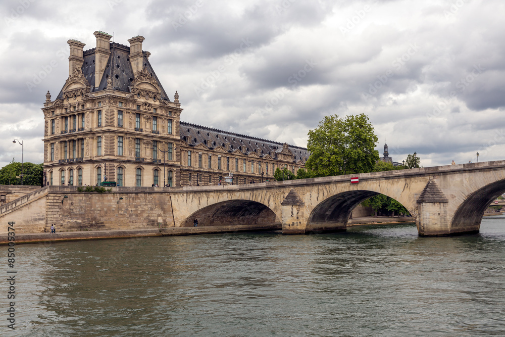 Pont Royal over Seine in Paris with view at the Louvre