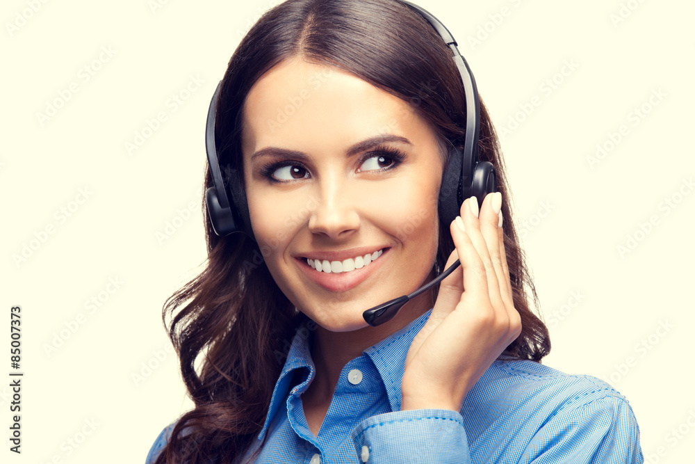 Portrait of happy smiling customer support phone operator Portrait of happy smiling customer support phone operator