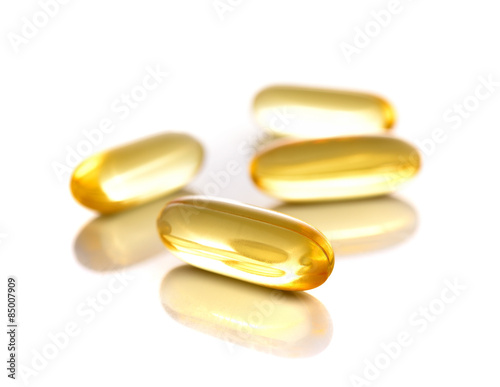 fish oil capsules on white background