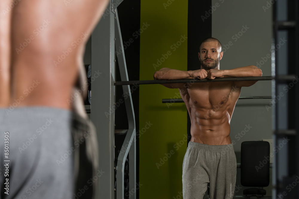 Portrait Of A Muscular Man Relaxing In Gym Portrait Of A Muscular Man Relaxing In Gym