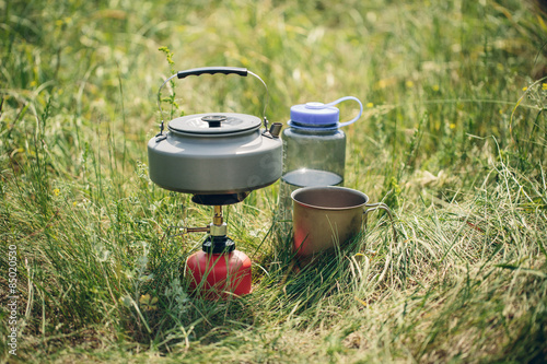 boiling water in kettle on portable camping stove
