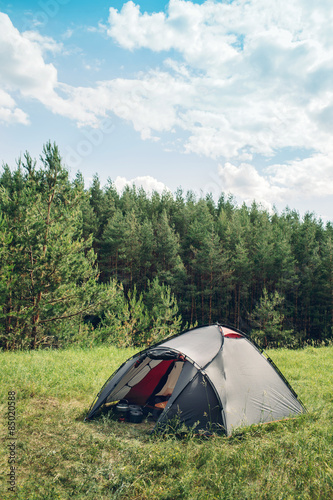  Grey tourist tent in summer forest