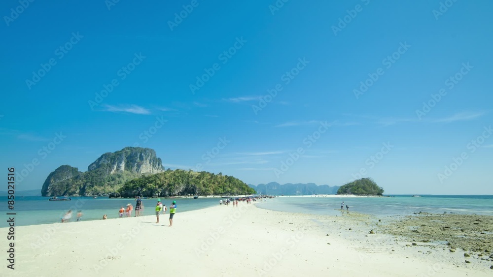 White sand beach in Thailand, Krabi, Tub island. Rising tide over sandy isthmus White sand beach in Thailand, Krabi, Tub island. Rising tide over sandy isthmus