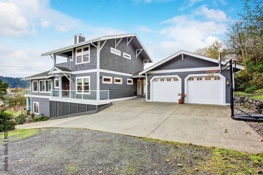 Large gray modern house and garage. Large gray modern house and garage.