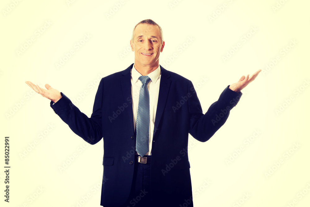 Businessman with open hands in undecided gesture Businessman with open hands in undecided gesture
