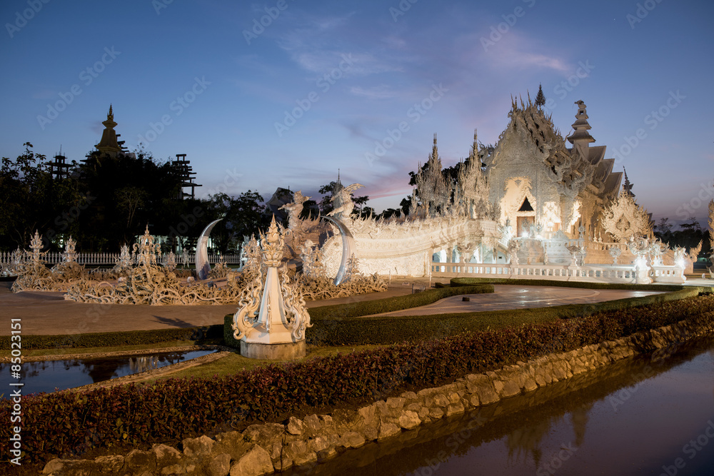 Twilight light at Wat Rong Khun (thai name) major religious attractions of Chiang Rai, Thailand.