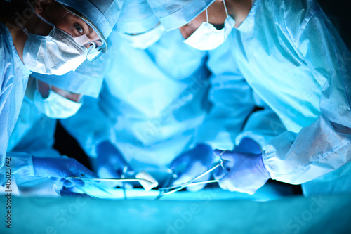 Team surgeon at work in operating room © lenetsnikolai