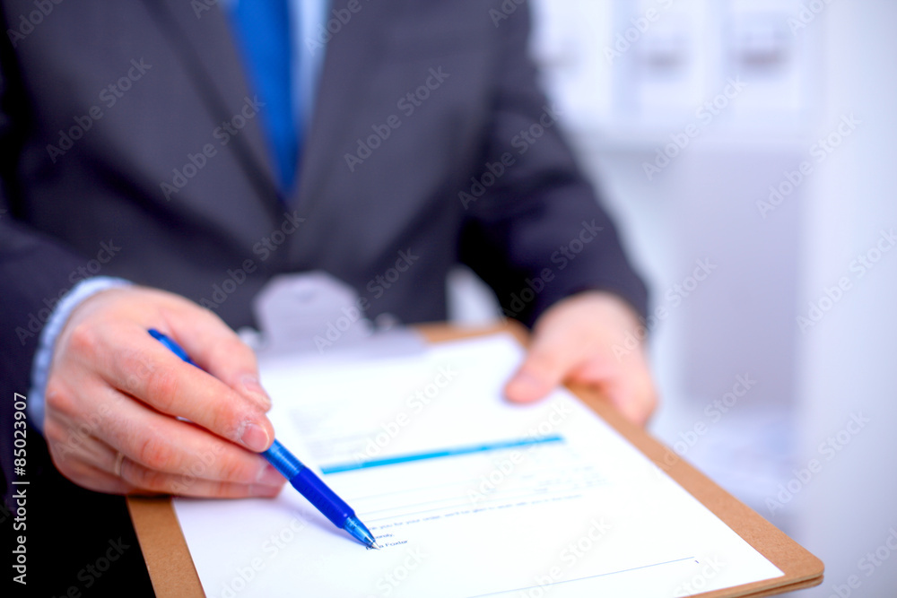 File folders, standing on shelves in the background File folders, standing on shelves in the background