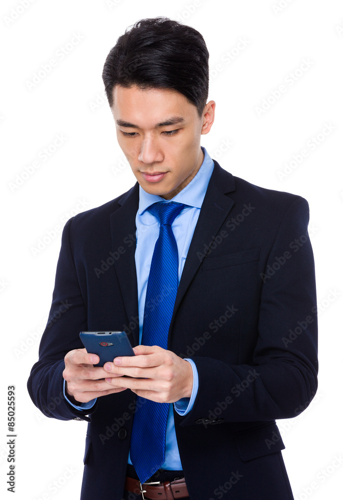Asian businessman read on cellphone Asian businessman read on cellphone