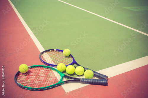 tennis racket and balls on the tennis court vintage color © FAMILY STOCK