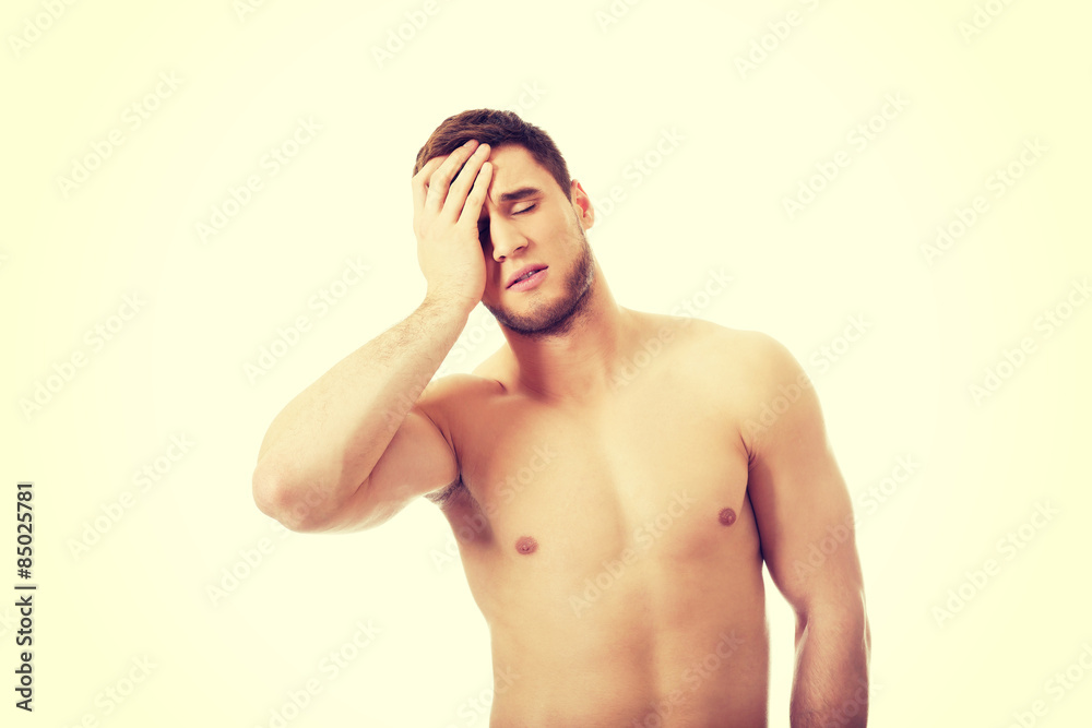 Fototapeta premium Athletic man feeling pain in his head.