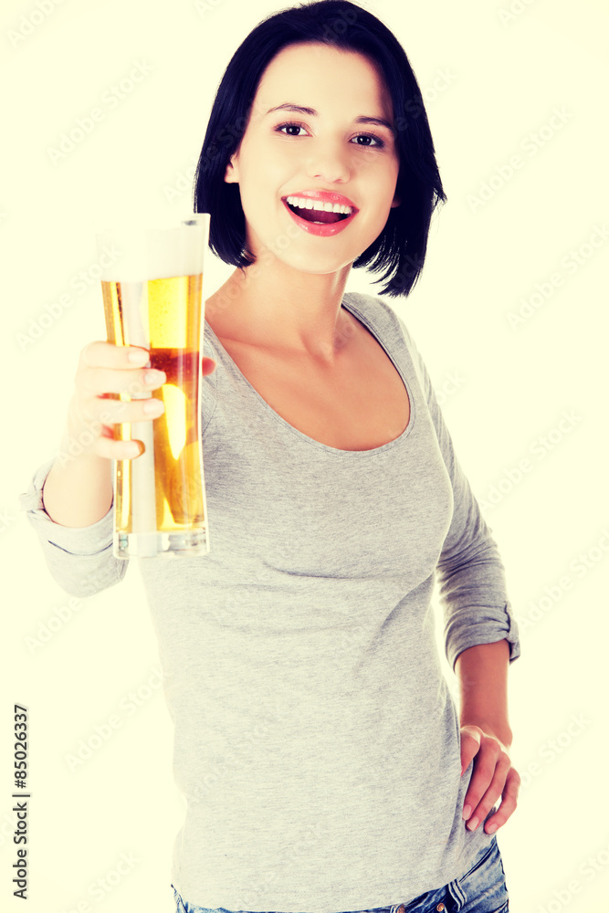 Young happy woman holding a glass of beer Young happy woman holding a glass of beer