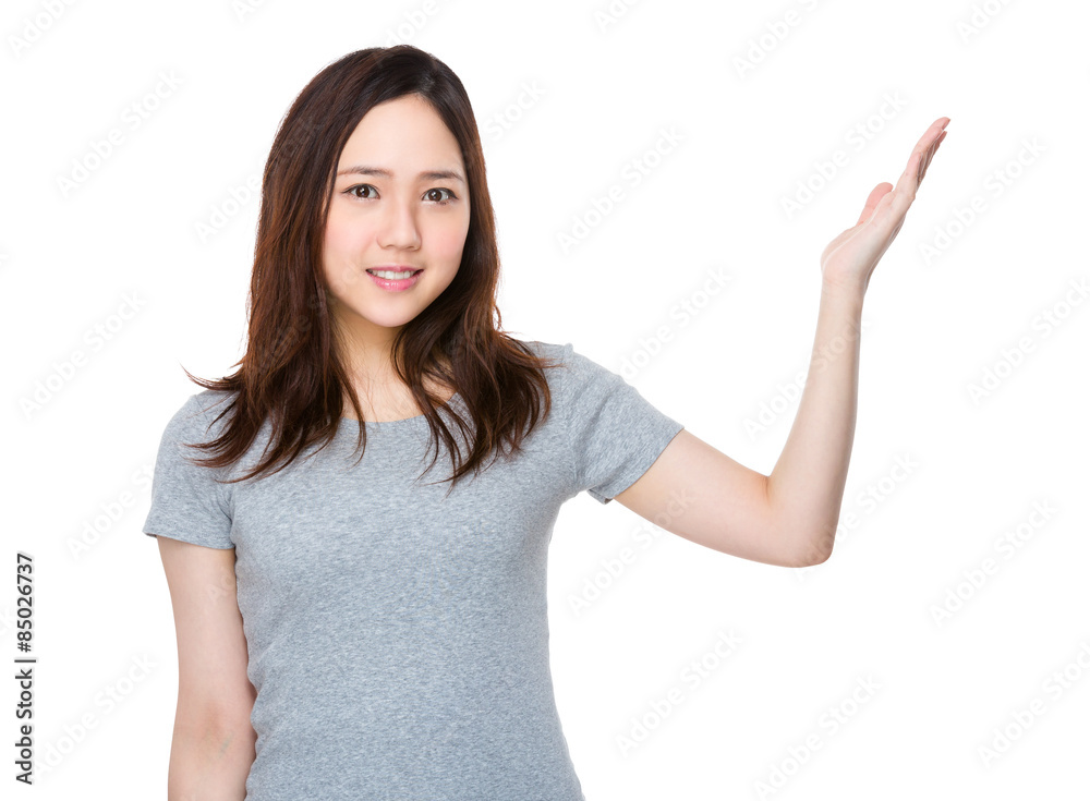 Asian woman with hand showing a blank sign Asian woman with hand showing a blank sign