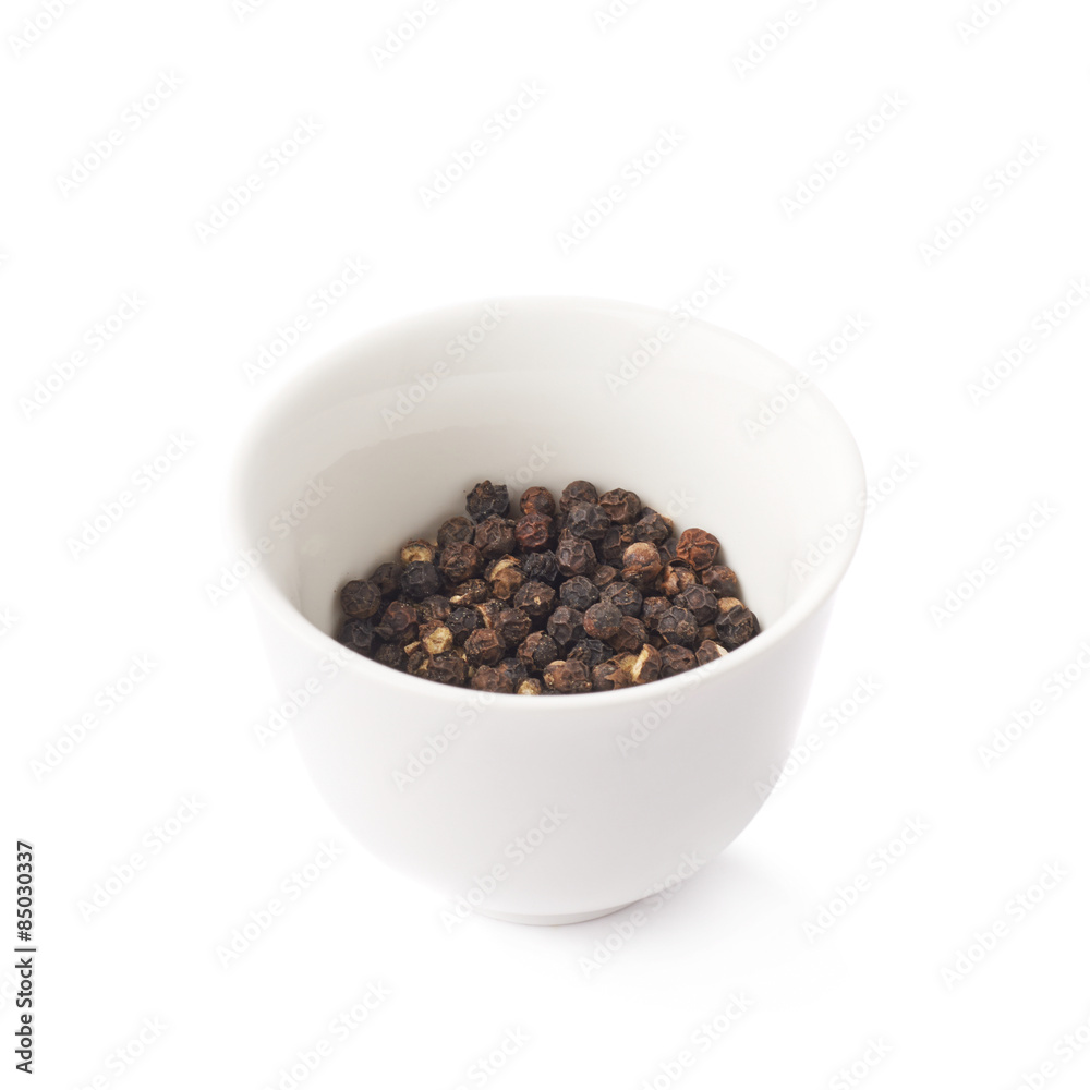 Cup filled with black peppercorn Cup filled with black peppercorn