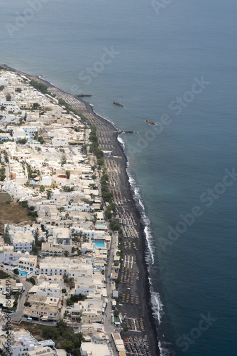 The black volcanic sand beach of Kamari, Santorini, seen from above