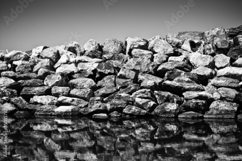 Rock wall protection from the waves - toned image