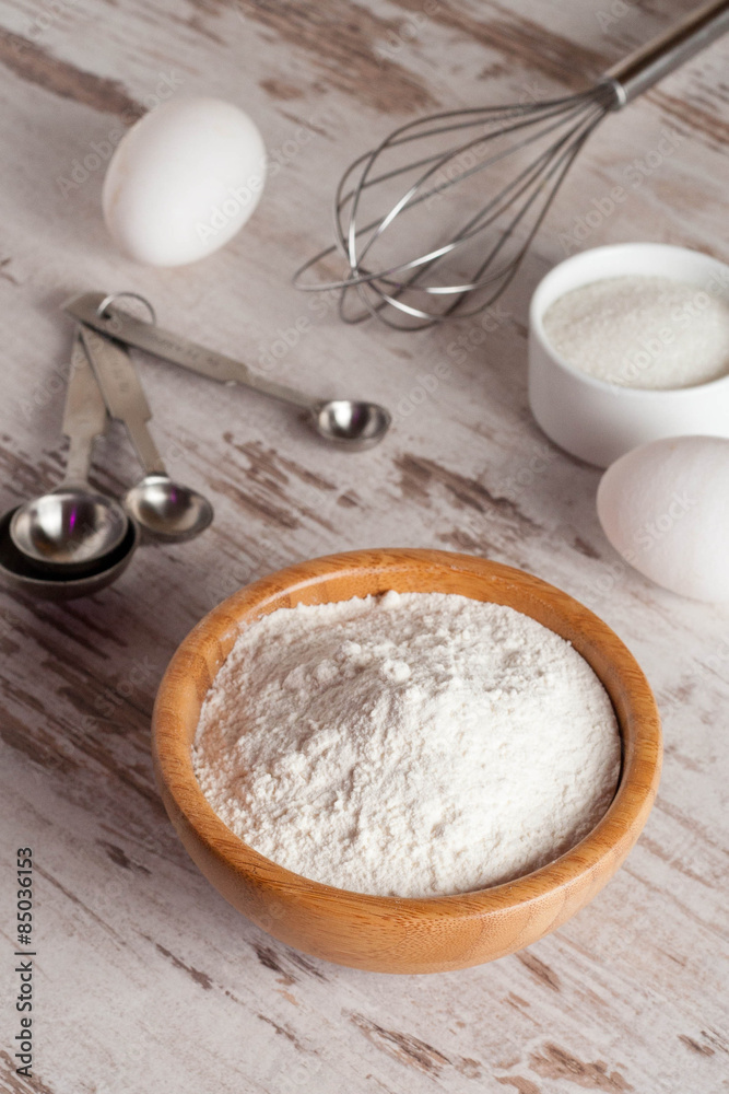 ingredients and tools to make a cake, flour, sugar,eggs