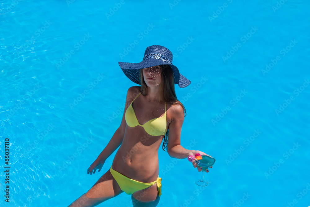 Young woman wearing a straw hat