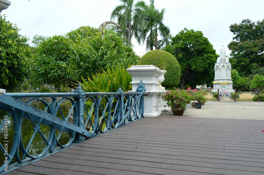 Marble monument tower and wooden bridge at Saranrom Royal Garden, Bangkok, Thailand Marble monument tower and wooden bridge at Saranrom Royal Garden, Bangkok, Thailand
