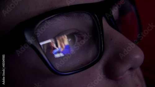 Young boy watching tv at night
