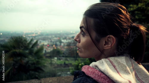 Pensive woman looking at cityscape view
