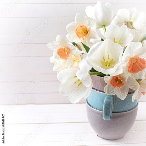 Background with fresh narcissus in vase