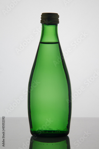 Empty bottle of water on white background