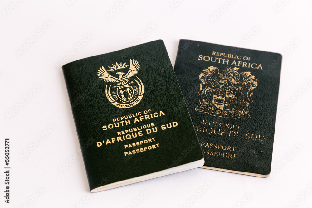 Old and new South African passports on white background Old and new South African passports on white background