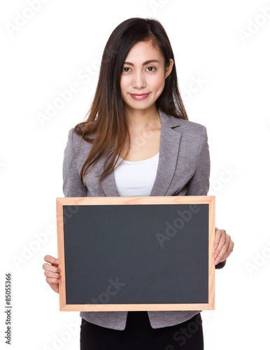 Young businesswoman showing with chalkboard