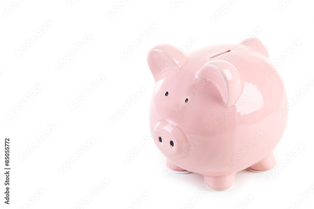Pink piggy bank with glasses on white wooden background