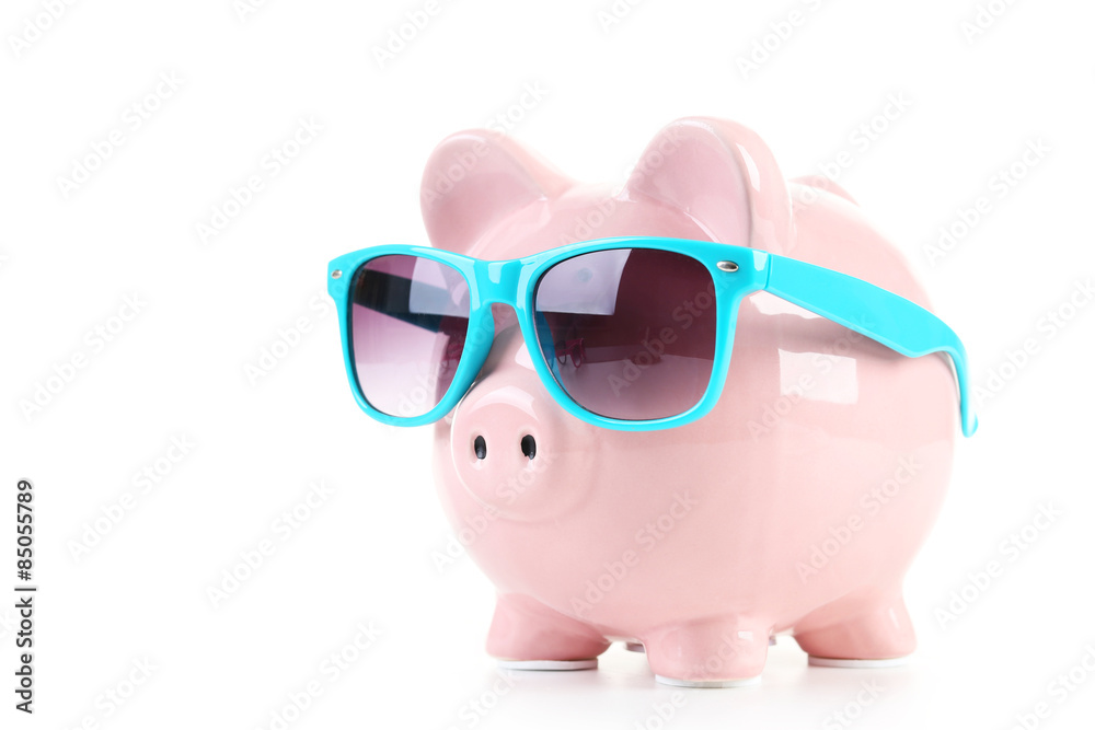 Pink piggy bank with glasses on white wooden background Pink piggy bank with glasses on white wooden background