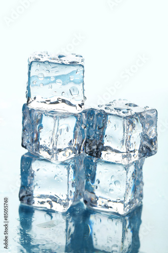 Ice cubes on blue background