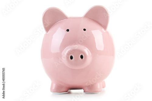 Pink piggy bank with glasses on white wooden background