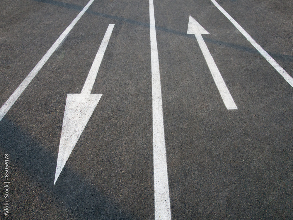 Directional arrow signs on the asphalt road. Directional arrow signs on the asphalt road.