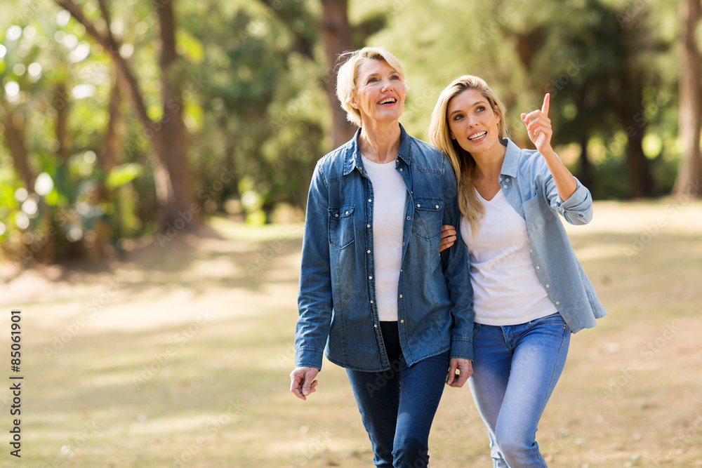 senior mother with daughter relaxing outdoors senior mother with daughter relaxing outdoors