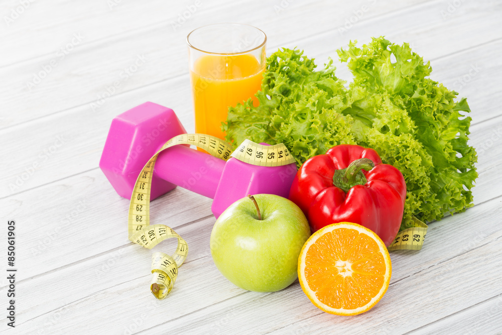 Fitness equipment and healthy food. Fitness equipment and healthy food.
