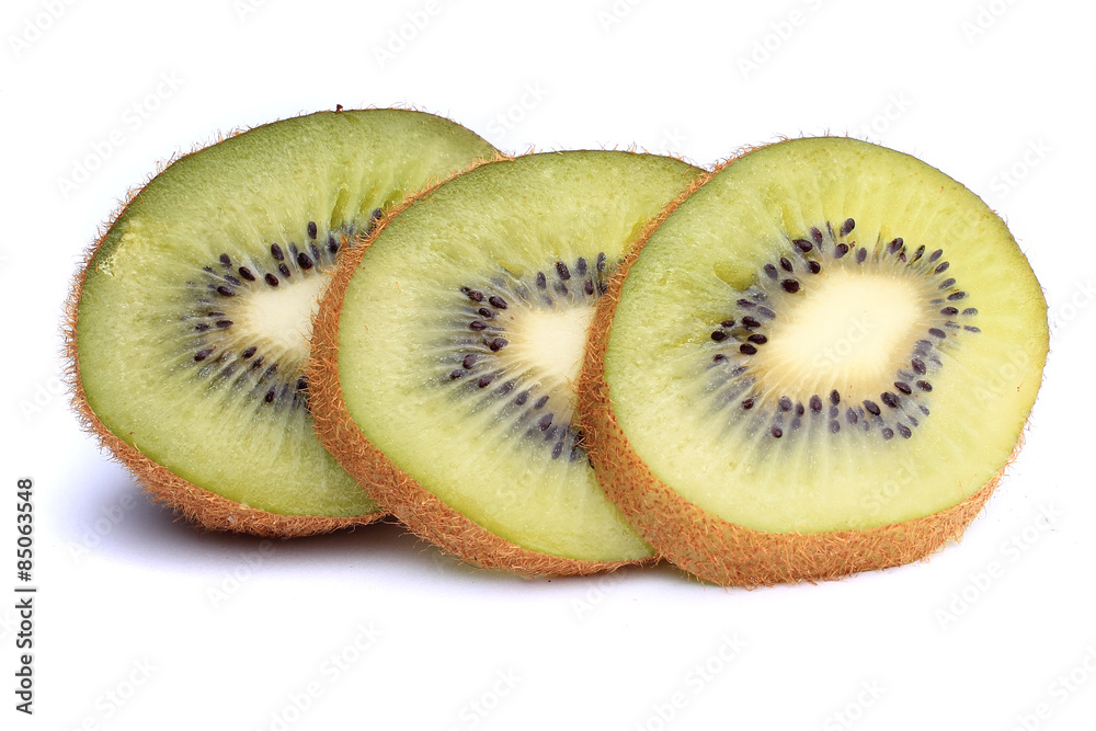 slices of ripe kiwi with mint leaves on a white background slices of ripe kiwi with mint leaves on a white background