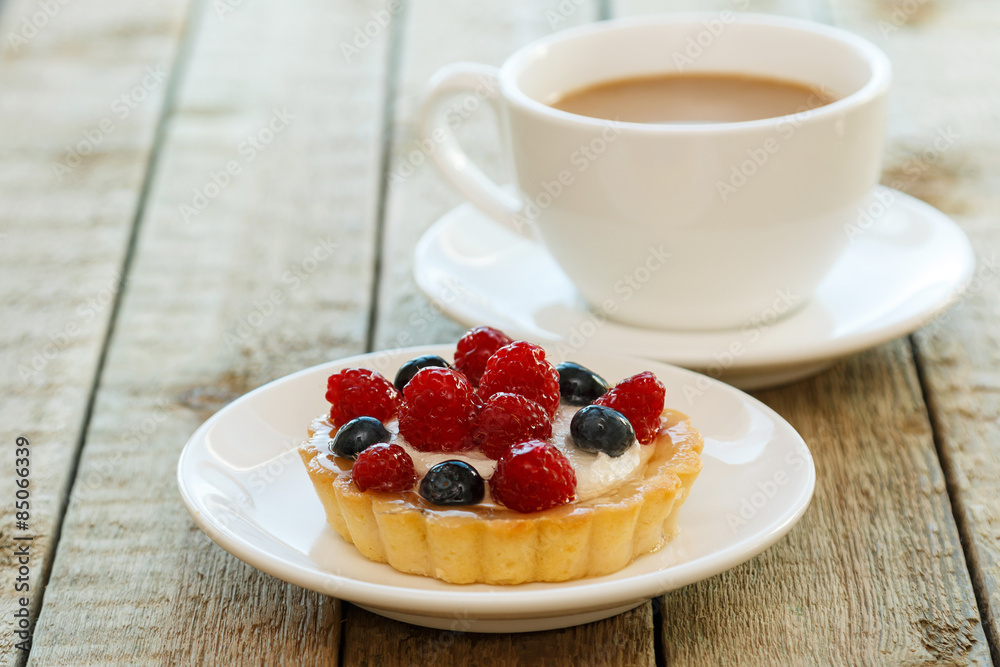 Cake with berries and cup of coffee Cake with berries and cup of coffee