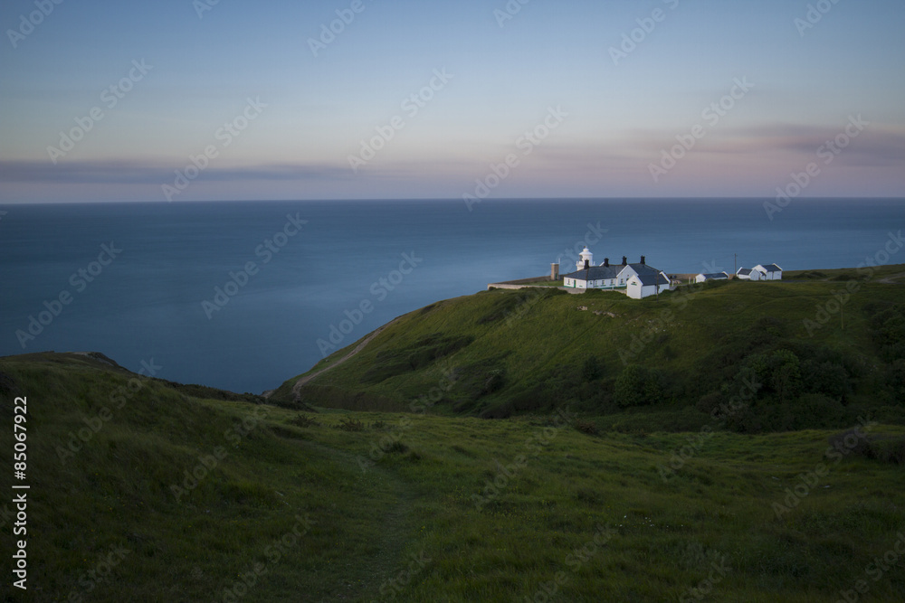 lighthouse at dawn sunrise