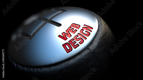 Web Design on Gear Stick with Red Text.